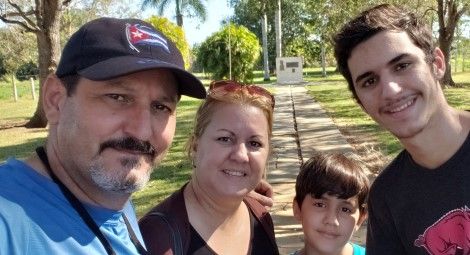 Reverend Carlos Sebastian Hernandez Armas (left) and his family.