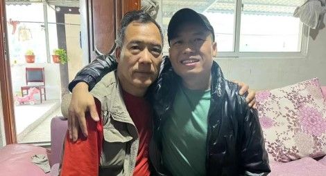 Caption: Wang Shunping (right) reunited with his father. Source: CSW.
