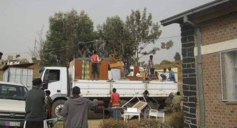 Property belonging to the health centre is loaded onto a lorry