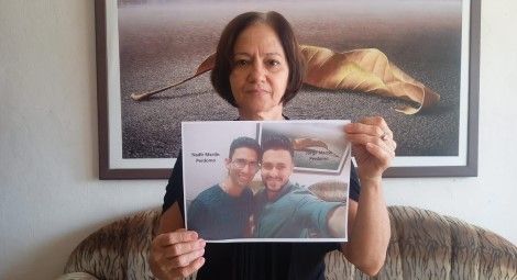Marta Perdomo holds a photo of her sons Jorge Martin and Nadir Perdomo. Credit: Martha Perdomo