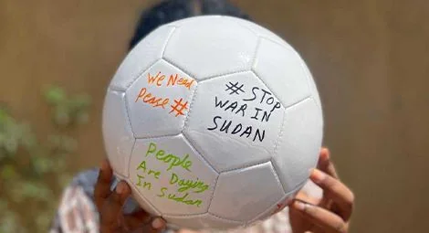 Footballs signed by Sudanese refugees