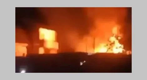 Christian homes on fire in Al-Fawakher village, Minya Province, on 23 April.
