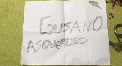 The sign left outside the priests home