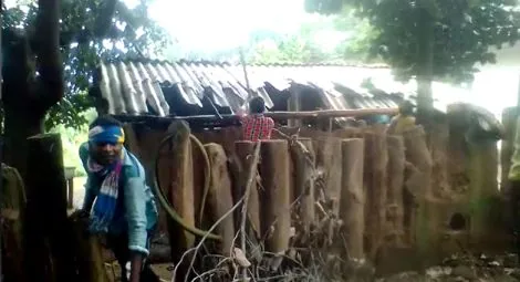 Members of the mob damage a home in one of the villages. Credit: CSW