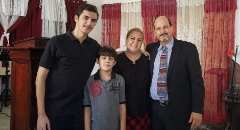 Reverend Carlos Sebastian Hernandez Armas (right) and his family.