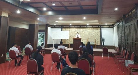Pastor Pan leading a church service in Jeju, South Korea