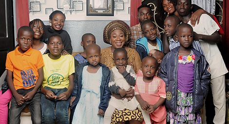 Professor Tarfa's wife Mercy with the children of Du Merci