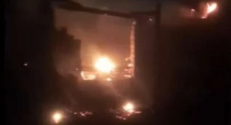 Fires seen in Nazlat Jalf village following an outbreak of sectarian violence on 23 October.