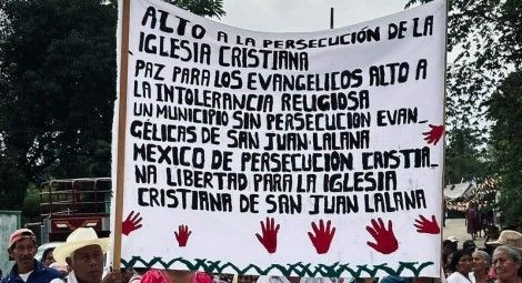 Christian families protest outside the municipal office of San Juan Lalana, Oaxaca, on 19 August.