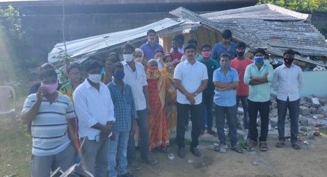 Members of Grace Prayer House, including Pastor Shyam Kumar, outside the demolished church building