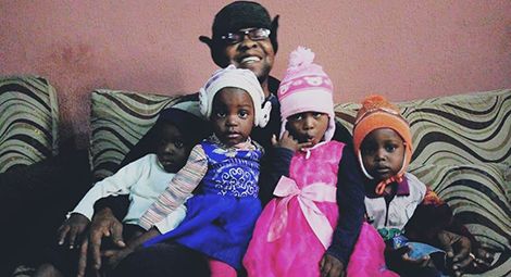 Professor Tarfa with four of the youngest Du Merci children. Credit: CSW
