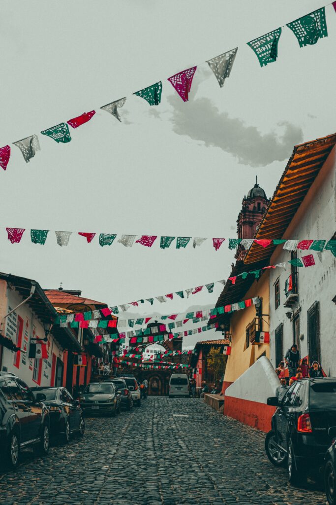 A street with flags flying in Michoacán, Mexico.