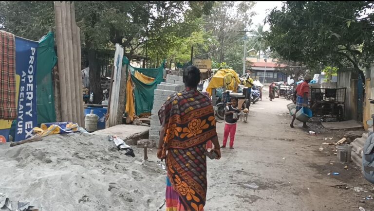 A Narikuravar woman walking through her hometown of Mappedu in Chennai, India.